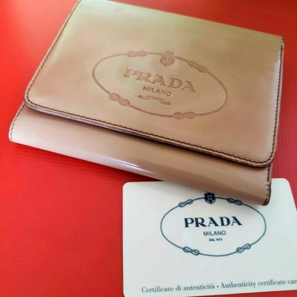 Prada Handbags - Beige Prada Trifold Wallet
